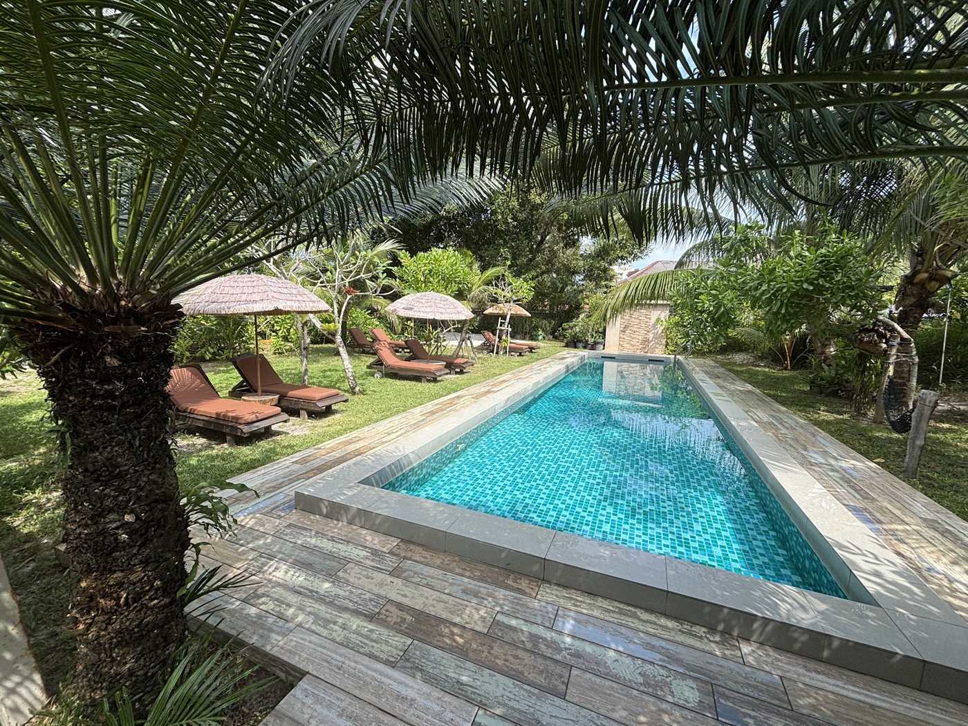 Pool with sun loungers